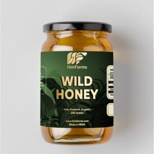 A glass jar of HimFarms Himalayan Wild Forest Honey with a branded label, sitting on a wooden cutting board with spilled honey, a dipper in the background, and a window view.