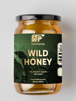 A glass jar of HimFarms Himalayan Wild Forest Honey with a branded label, sitting on a wooden cutting board with spilled honey, a dipper in the background, and a window view.